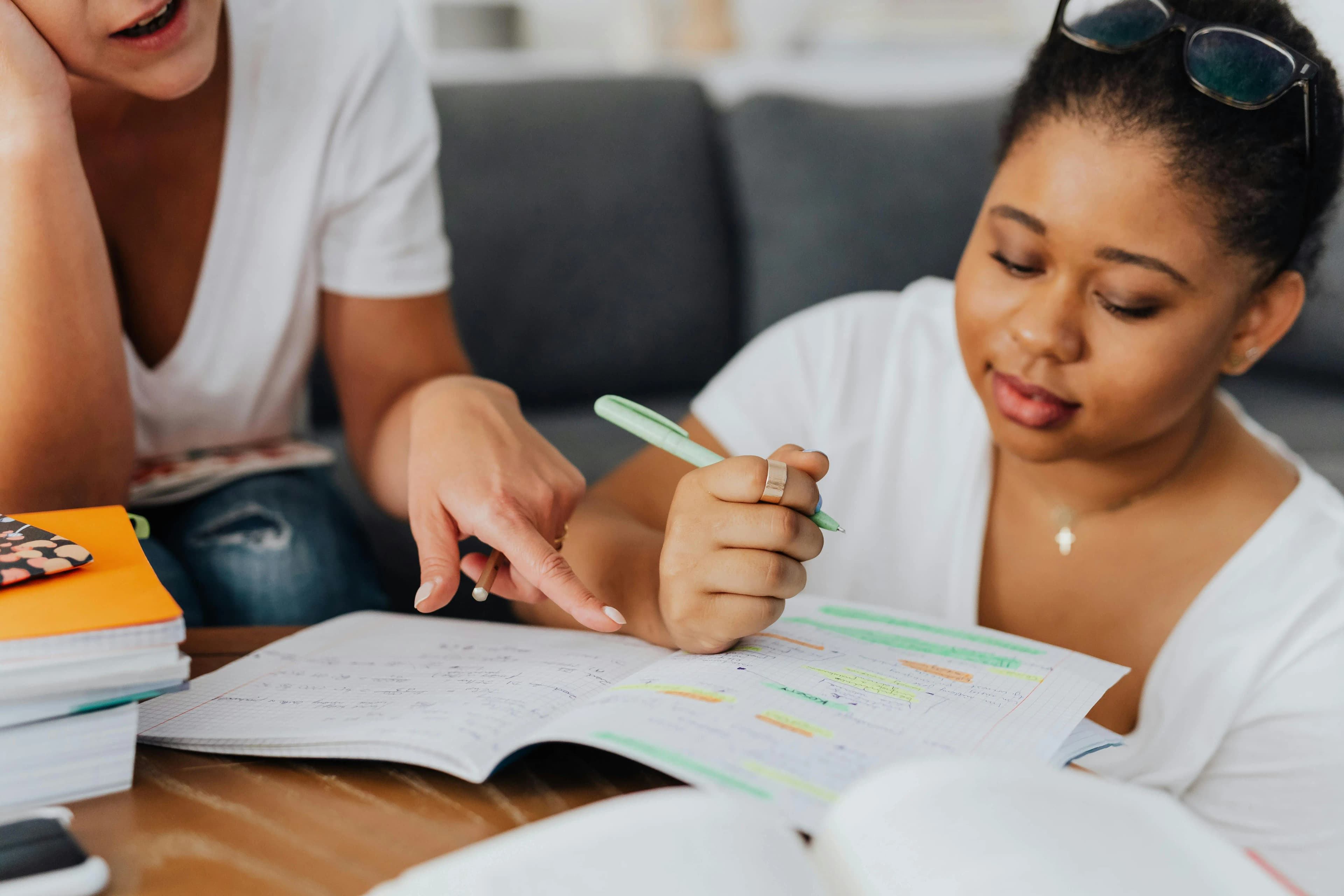 Tutor teaching at student home